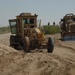 US troops repair a roadway near Iraq border