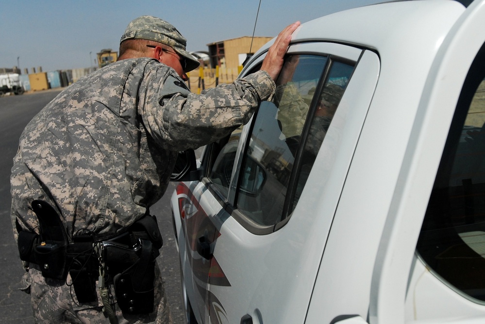 Military Police patrol Contingency Operating Base Basra to enforce law and order