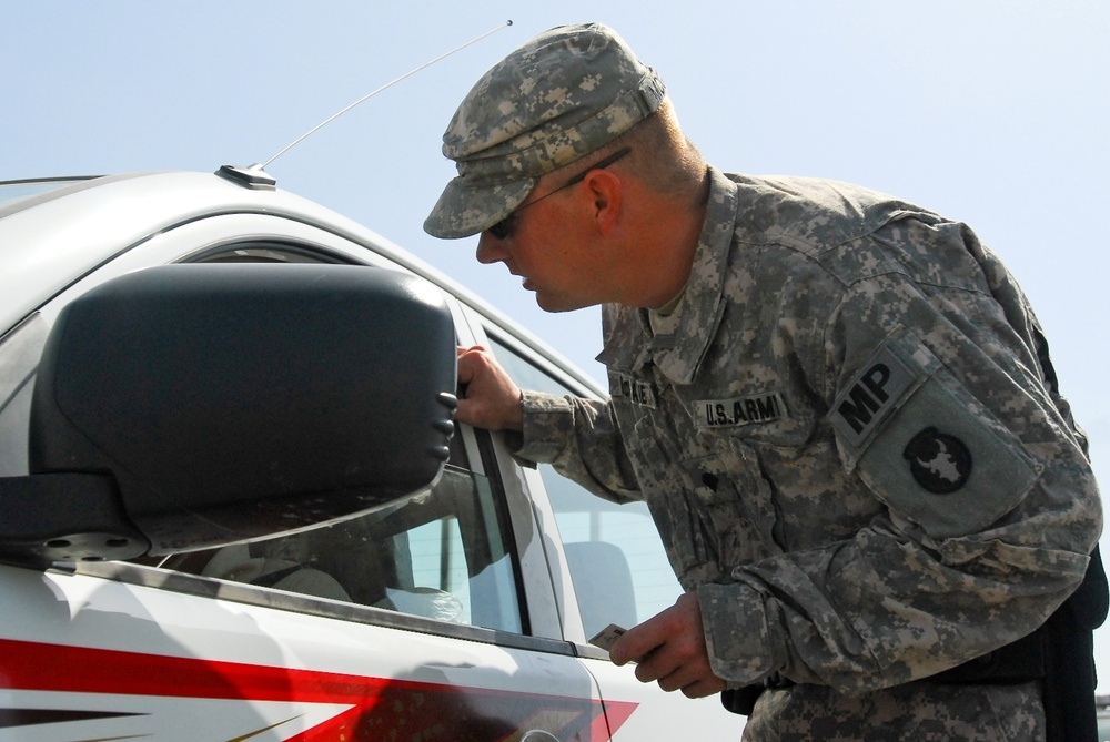 Military Police patrol Contingency Operating Base Basra to enforce law and order