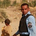Iraqi soldiers hand out food in Tal Adh Dhah