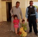 Iraqi soldiers hand out food in Tal Adh Dhah