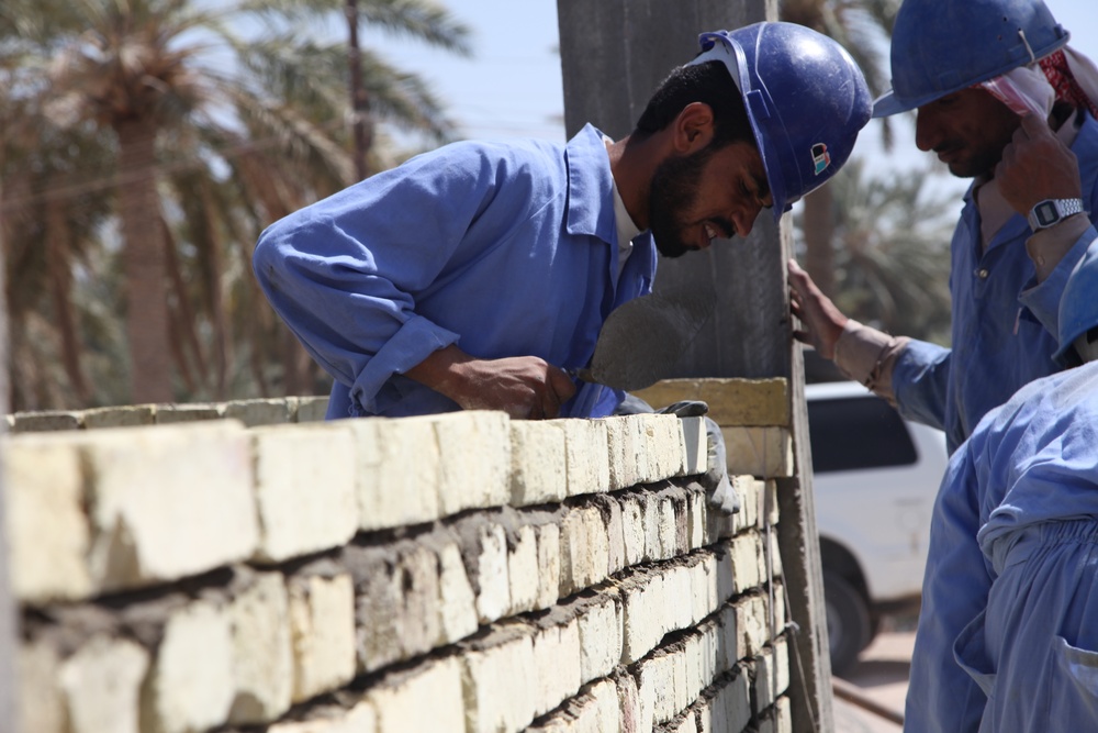 Soldiers check up on the Said Dikil school construction site