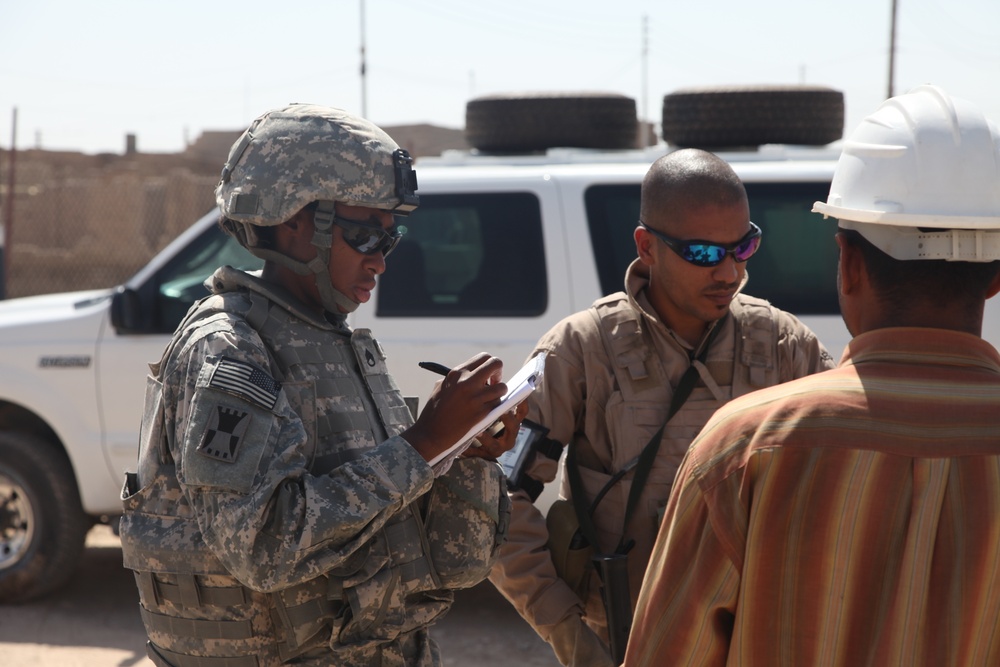 Soldiers check up on the Said Dikil school construction site