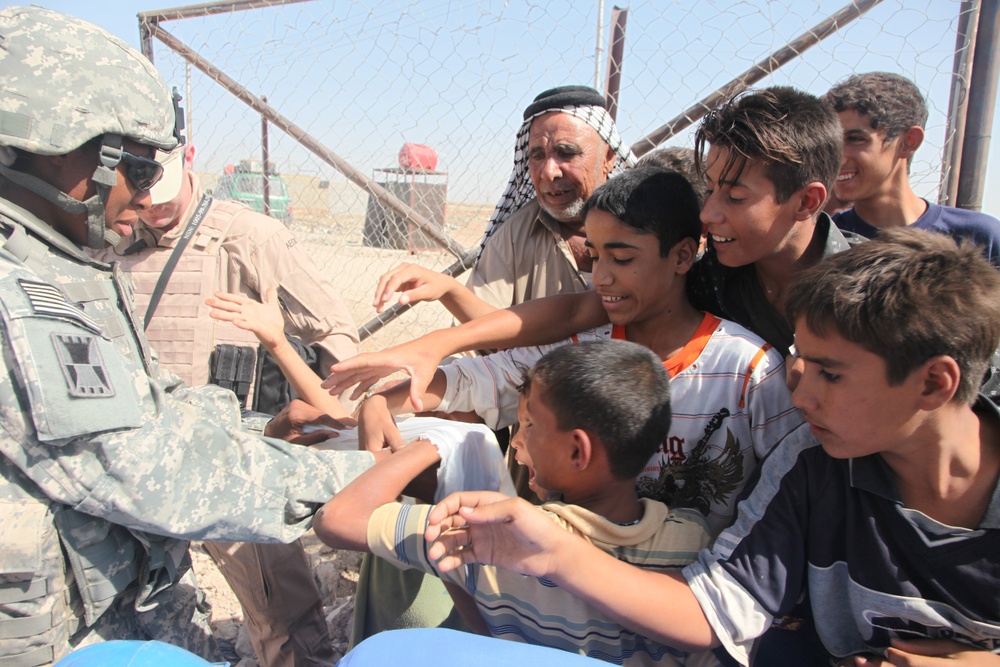 Soldiers check up on the Said Dikil school construction site