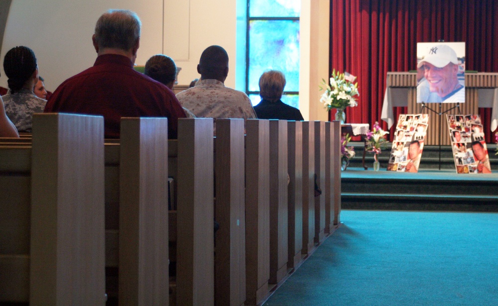 Tears Fall During Memorial Service Held for Fallen Marine