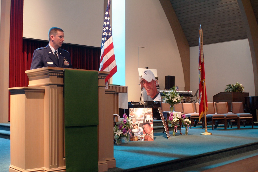 Tears Fall During Memorial Service Held for Fallen Marine