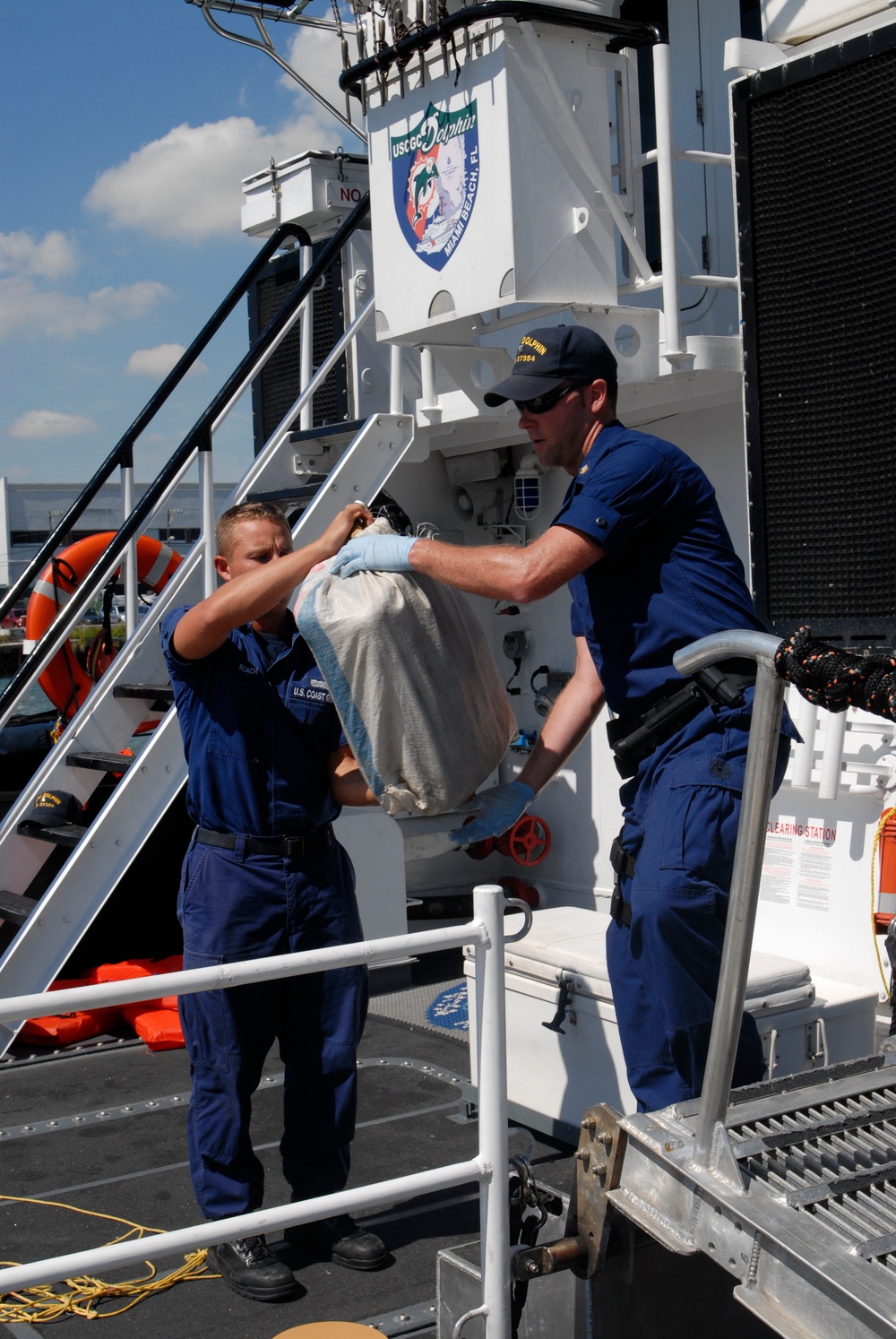 Coast Guard Cutter Dolphin Crew members Offload 2,500 Pounds of Marijuana