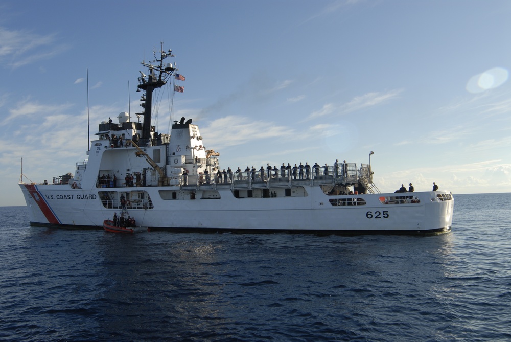 Coast Guard Cutter Dolphin Crewmembers Offload 2,500 Pounds of Marijuana