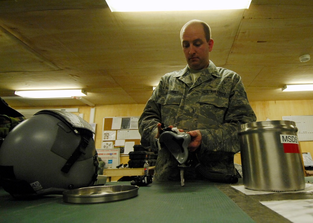 Airmen cleaning flight equipment