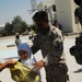 U.S., Iraqi soldiers visit school children