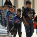 U.S., Iraqi soldiers visit school children