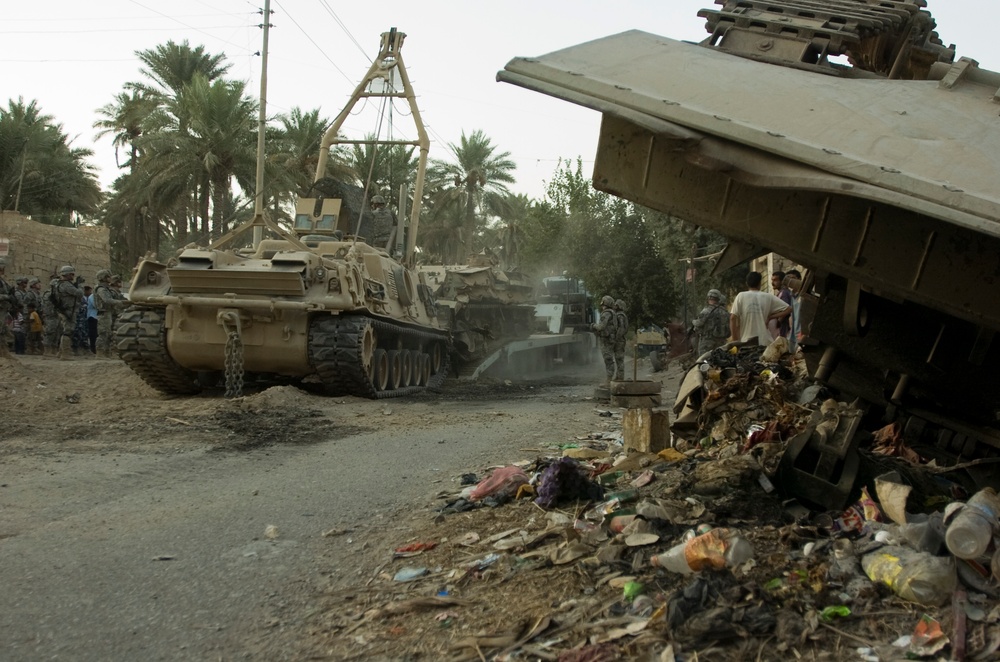 Combined Effort Works to Remove Tank Hulls From Iraqi Town