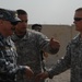 Iraqi general visits with artillery soldiers