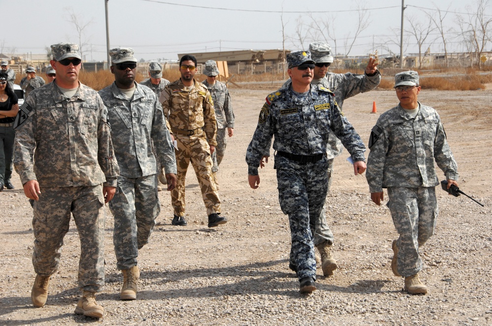 Iraqi general visits with artillery soldiers