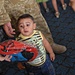 U.S. and Iraqi Soldiers bring backpacks to Baghdad kindergarten