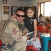 U.S. and Iraqi Soldiers bring backpacks to Baghdad kindergarten