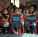 U.S. and Iraqi Soldiers bring backpacks to Baghdad kindergarten