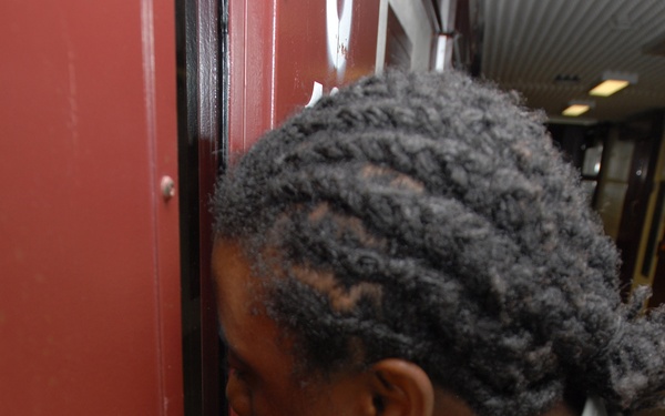 Food service soldier checks on detainee