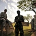 U.S. Soldiers Attached to Combined Joint Task Force-Horn of Africa Talk to a Uganda Peoples Defense Force Soldier in Jinja.