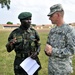 Sgt. 1st Class William Strobeck talks to Uganda Peoples Defense Force Chief Warrant Officer Donald Okumu.