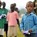 Children of Uganda Peoples Defense Force soldiers stand watching a graduation ceremony at the UPDF Non-Commissioned Officers Academy in Jinja.