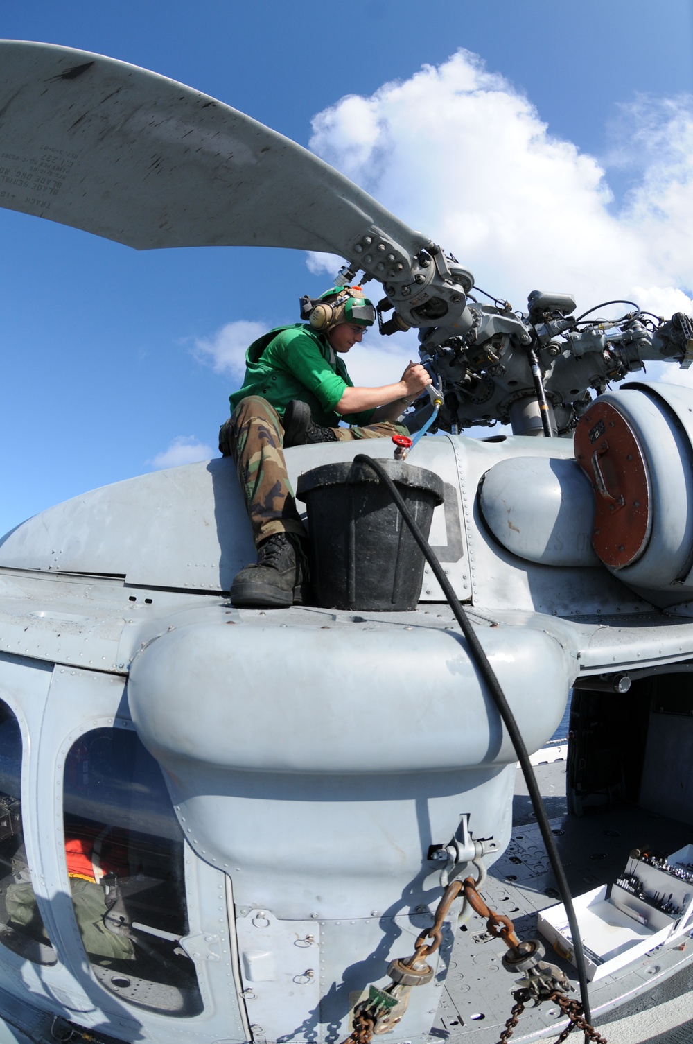 USS Wasp Marines, Sailors maintain helicopters