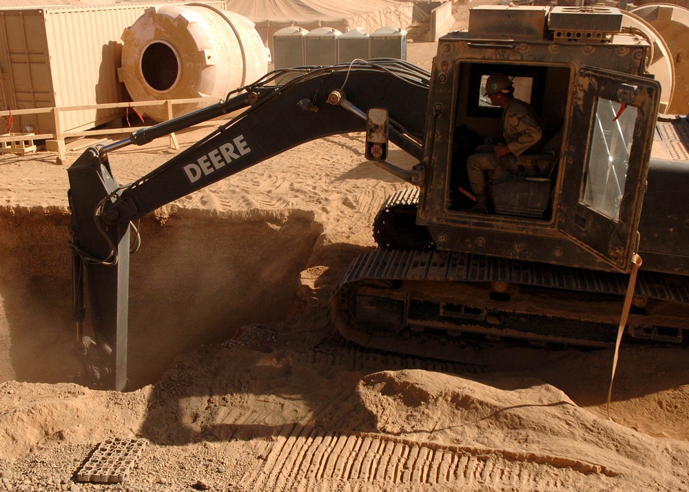 Seabee Excavates Septic Tank for Marines