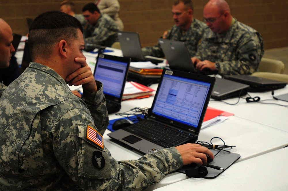 Soldiers From 1-168th Infantry Regiment Fill Out Periodic Health Assessment Forms to Assist Soldier Readiness Processing