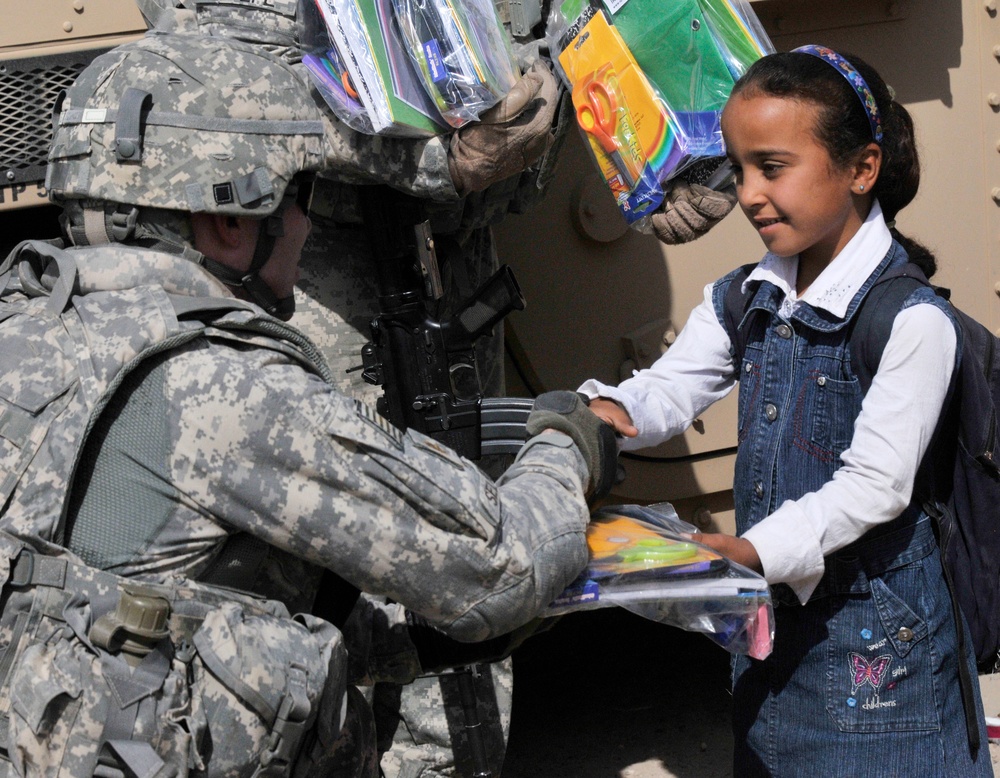 Soldiers deliver school supplies