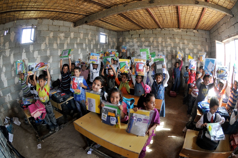 Soldiers deliver school supplies