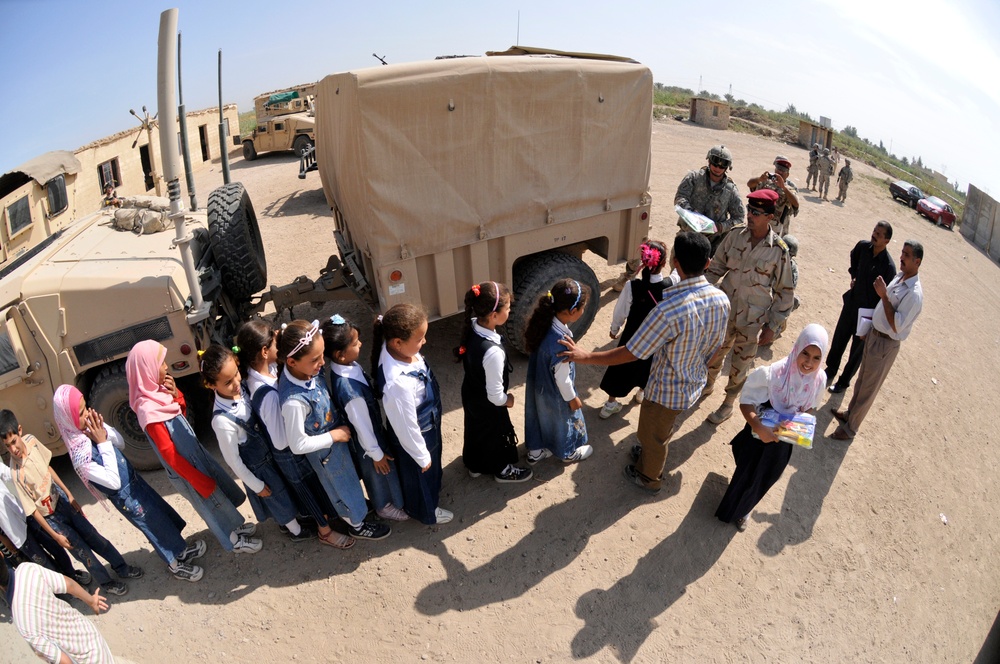 Soldiers deliver school supplies