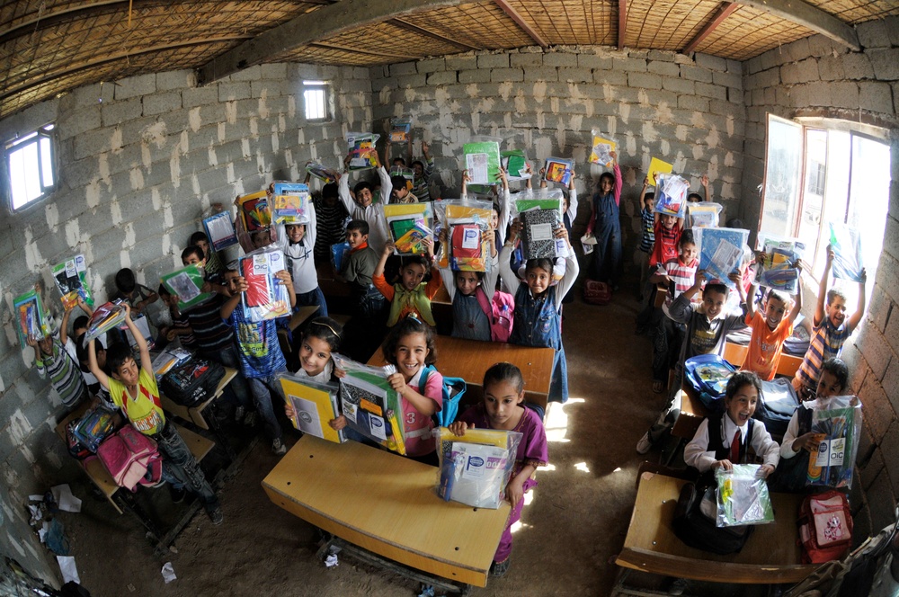 Soldiers deliver school supplies