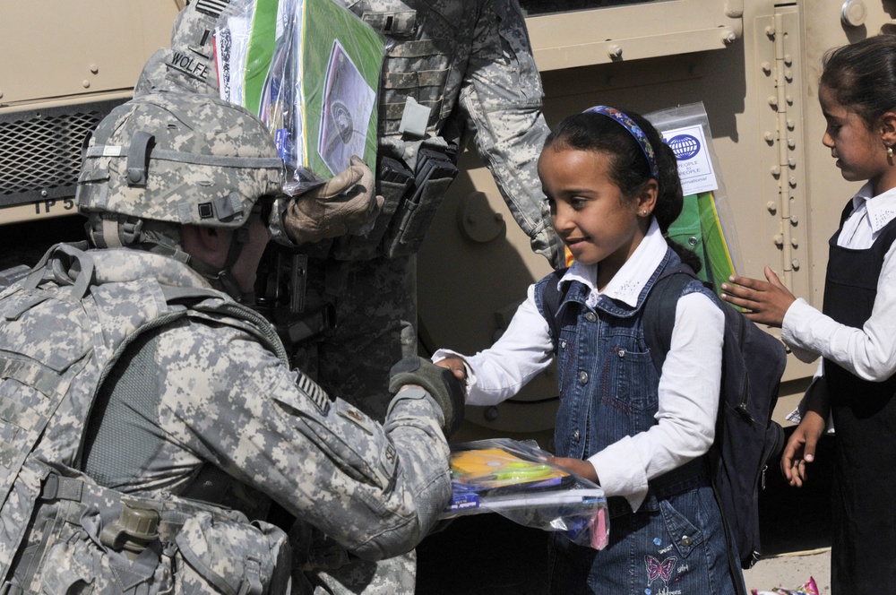 Soldiers deliver school supplies