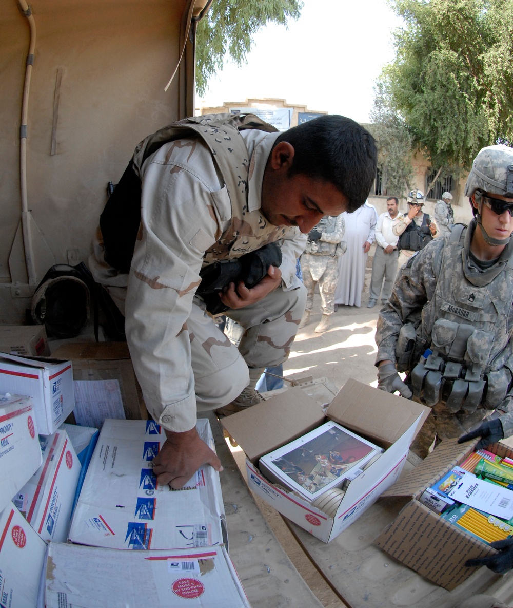 Soldiers deliver school supplies