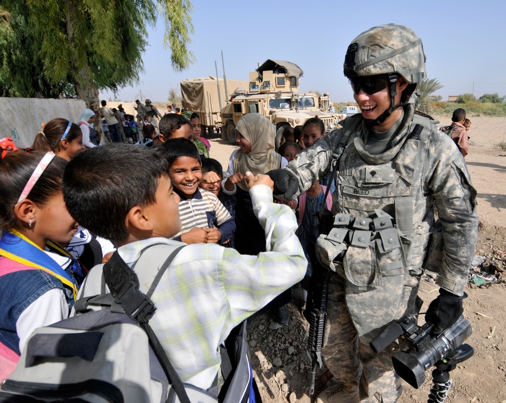 Soldiers deliver school supplies