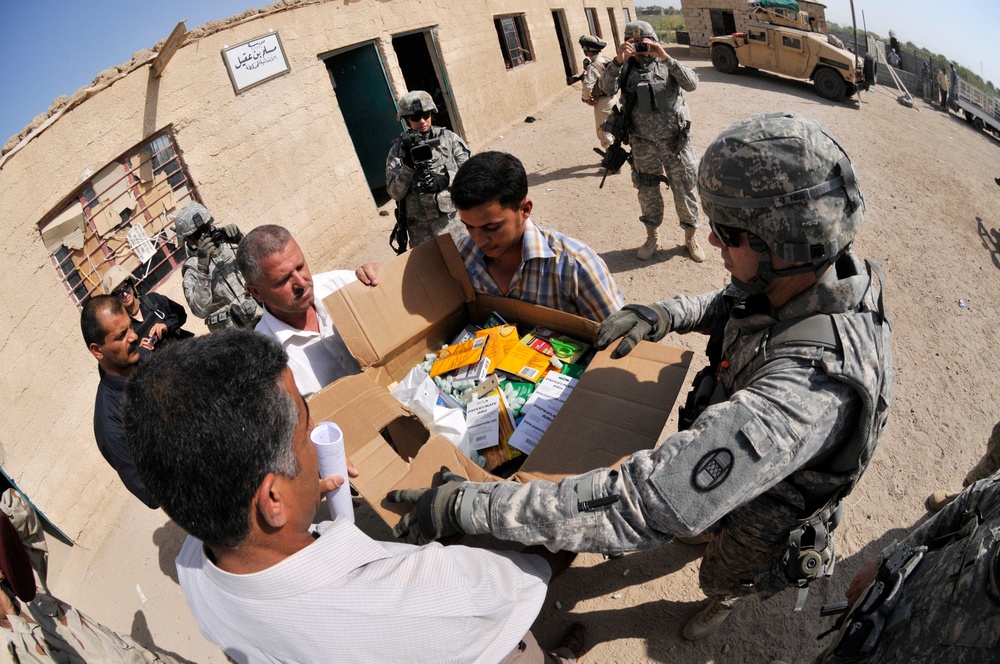 Soldiers deliver school supplies