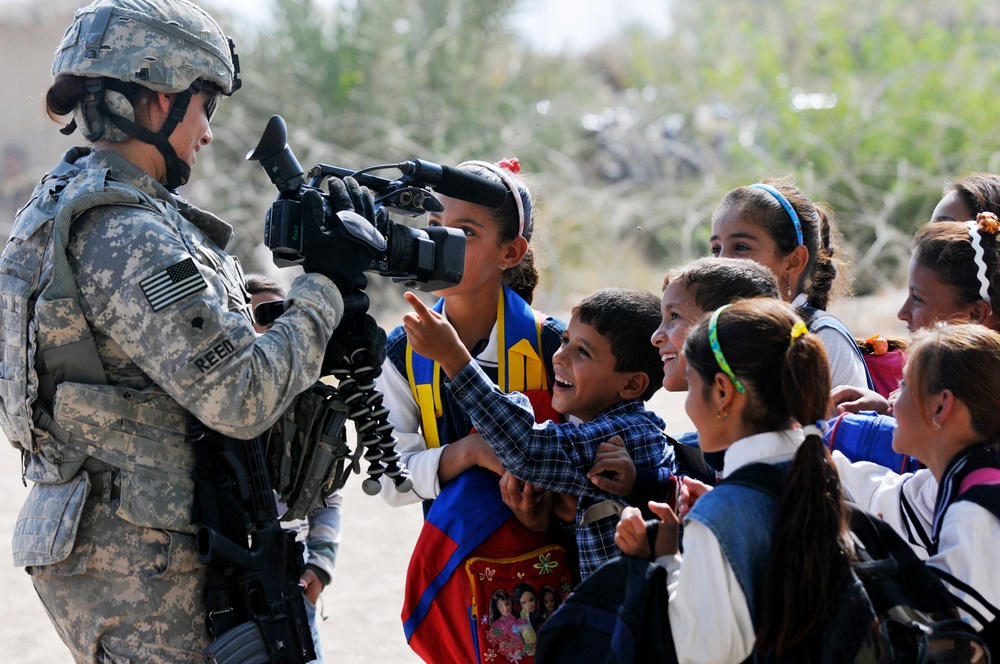 Soldiers deliver school supplies