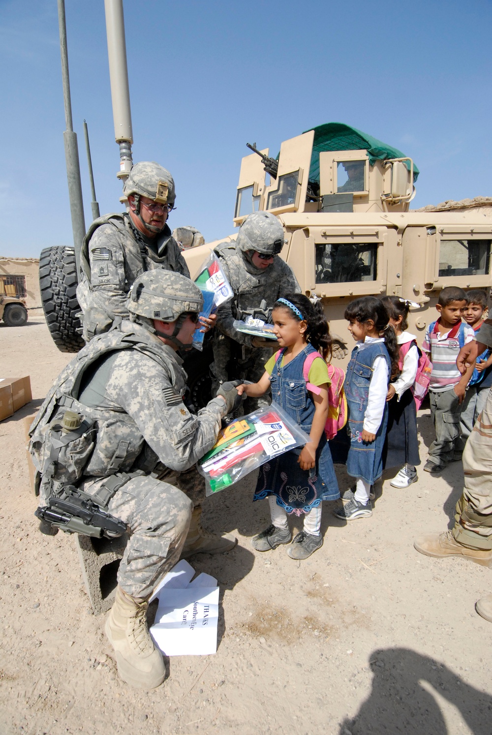 Soldiers deliver school supplies