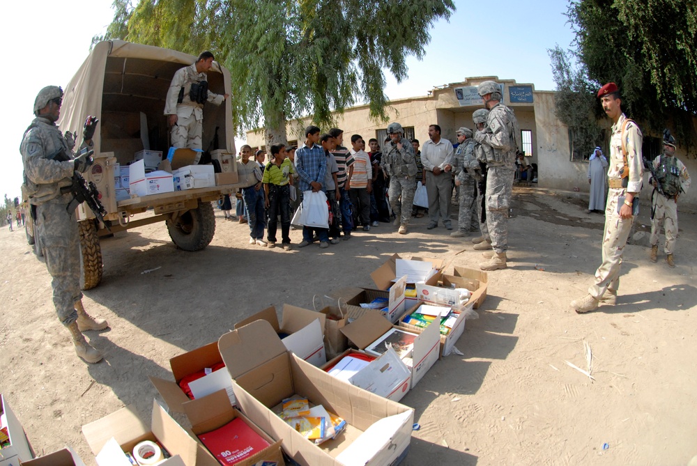 Soldiers deliver school supplies