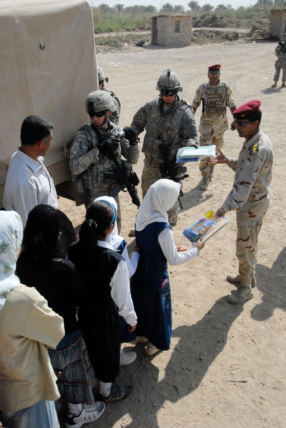 Soldiers deliver school supplies