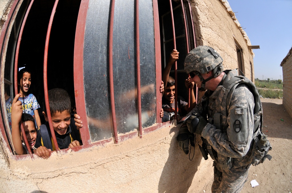 Soldiers deliver school supplies