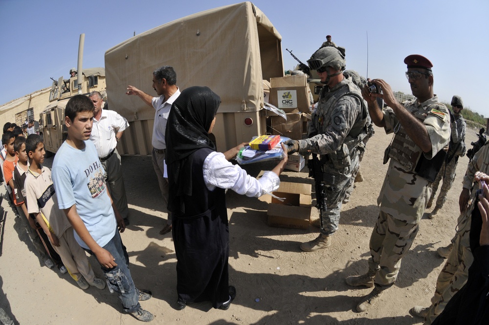 Soldiers deliver school supplies