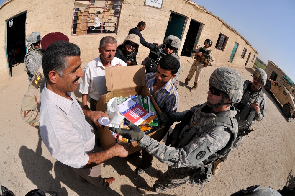 Soldiers deliver school supplies