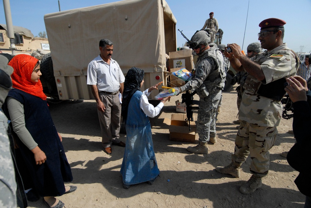 Soldiers deliver school supplies