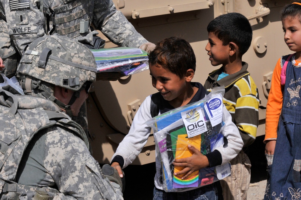 Soldiers deliver school supplies