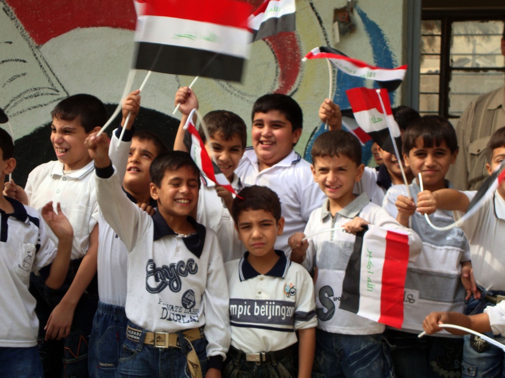 Iraqi Children Wave Iraqi Flags