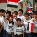 Iraqi Children Wave Iraqi Flags