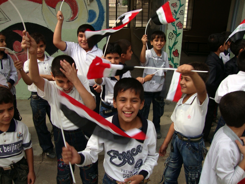 Iraqi Children Wave Iraqi Flags