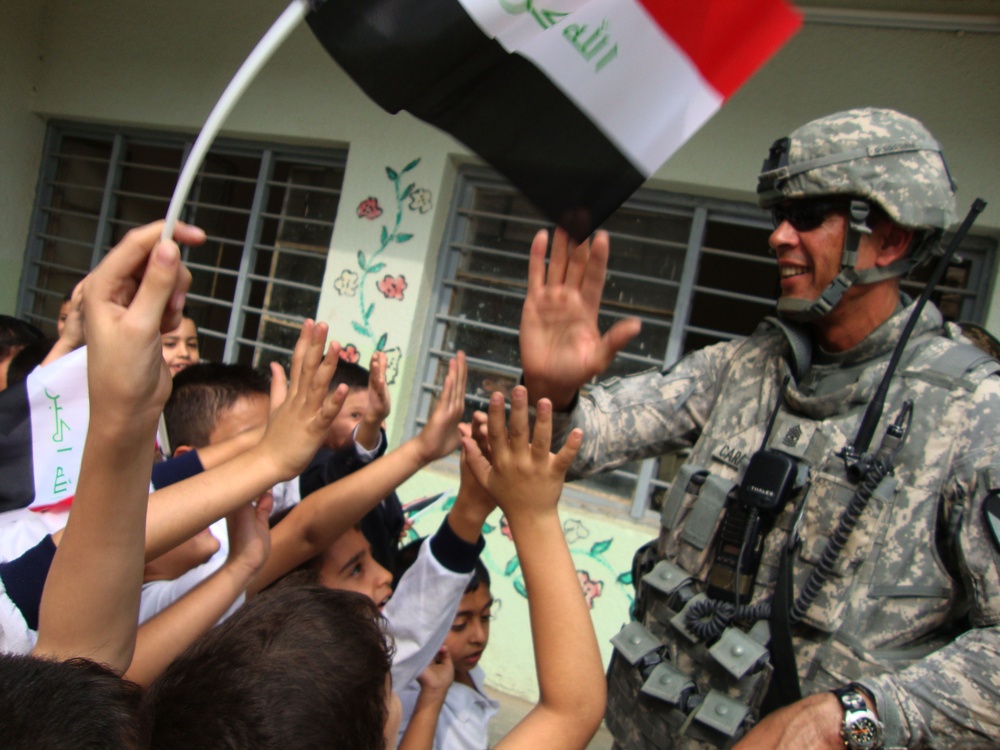Iraqi Children Wave Iraqi Flags
