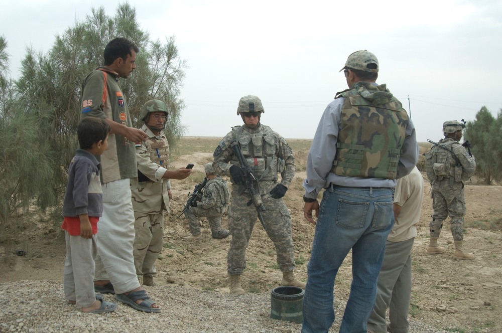 Soldiers visit Sanjar, talk micro-grants